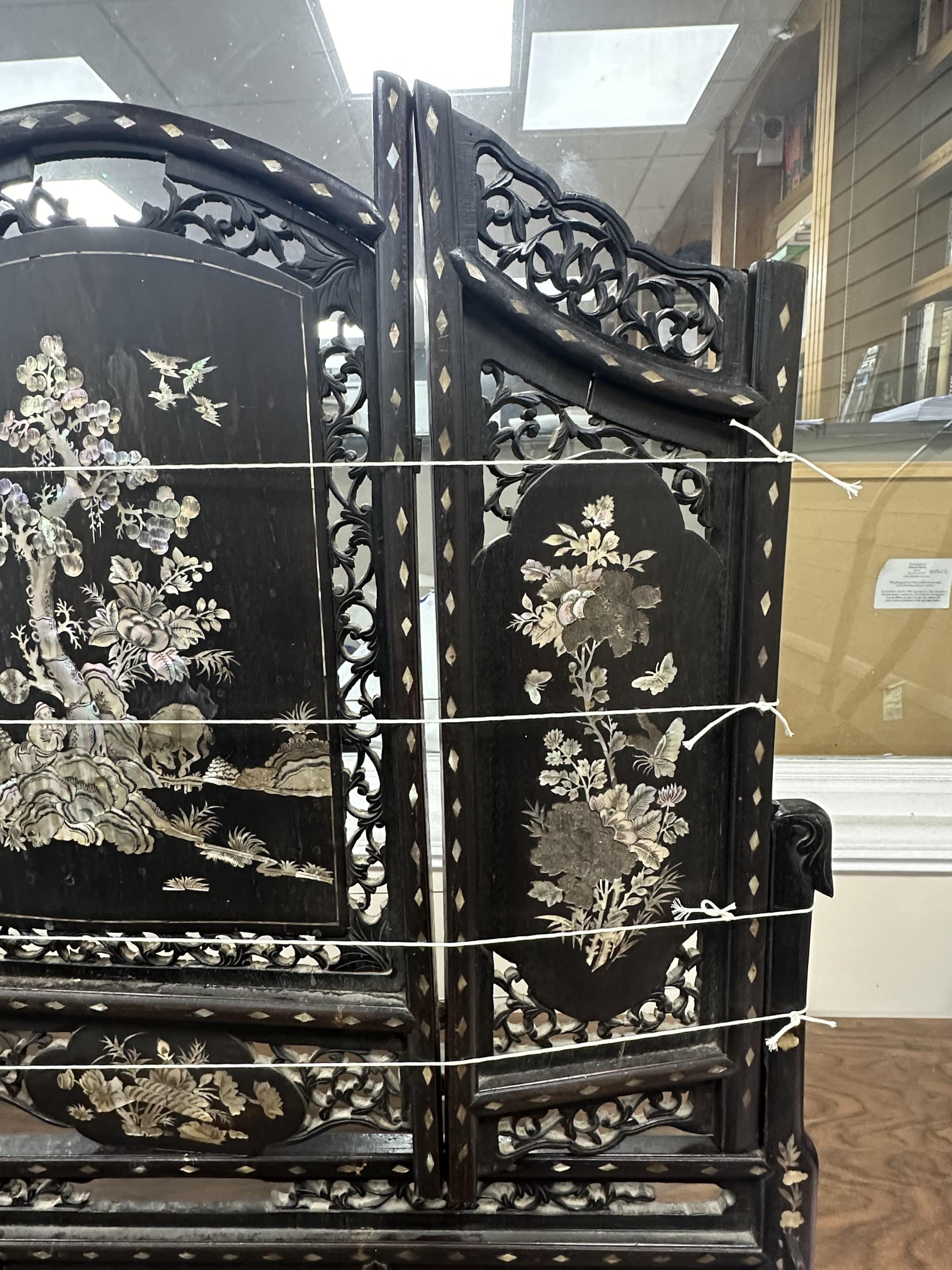 A Chinese mother of pearl inlaid hardwood table screen, width 78cm, height 86cm. Condition - poor to fair